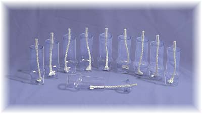 The long oil tubes with the wickholders and wicks